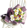 Be A Wildflower Daisy Bouquet. Mixed coloured selection of daisies in a floral wrap with a designer ribbon. Flower Gifts from Monthly Sommelier USA - Same Day USA Delivery.