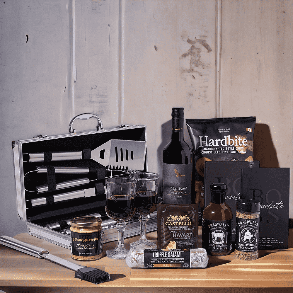 BBQ, Meat, & Cheese Wine Gift Basket features: Grilling Tool Set, 2 Fontana (Wine Glasses), A bottle of Wine, Mustard, Steak Seasoning, BBQ Sauce, Cheese, Chips, Chocolates, & a Wagener's Truffle Salami - Mild.