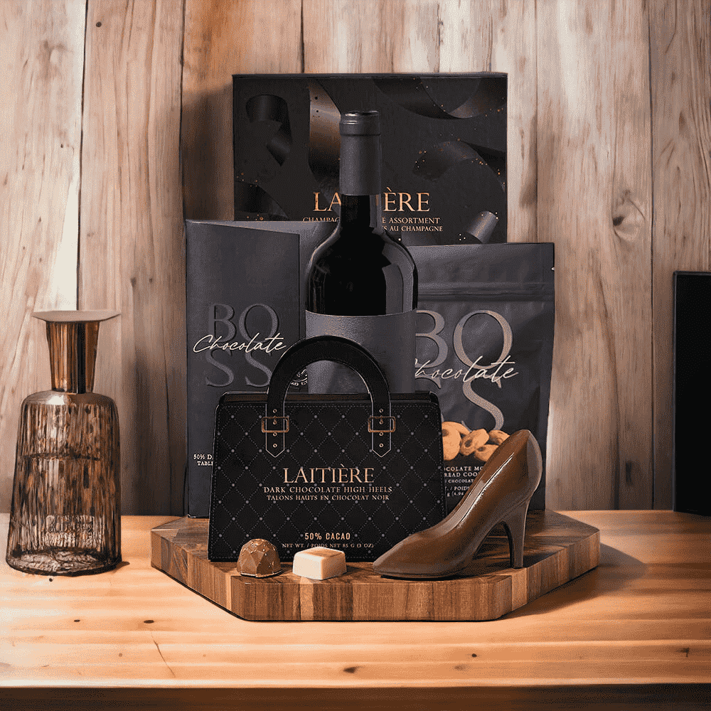 Chocolates charm everyone! Chocolate & Wine Gift Set features: Wine, Chocolate, Cookies, & Hexagonal Acacia End Grain cutting Board.