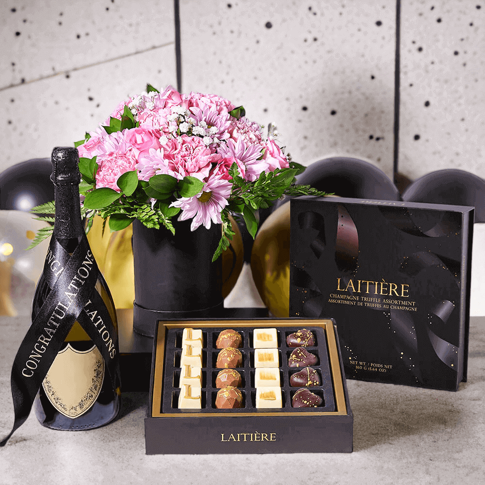 Happy Graduation Gift Set features a box of gourmet chocolate truffles and a traditional arrangement of flowers in a hat box for presentation and delivery.