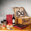"Let's Go for a Picnic Gift Basket with Wine" features sweet delights like four vanilla cupcakes, chocolate truffles, and two wine glasses, all in a lovely wicker picnic basket with cutlery.