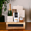 "Party Time" Sparkling Wine Gift Crate features Sparkling Wine, Cookies, Chocolate, Nuts, Marmalade, and a Small Slate Front Wooden Box.