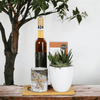 Add a touch of natural elegance to your beautiful home with the Succulent & Wine Gift Basket, 