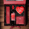 The Romantic Wine Gift Box is packaged in a simple and elegant hinged gift box and filled with chocolates, a bottle of wine, and a handmade heart cookie. 